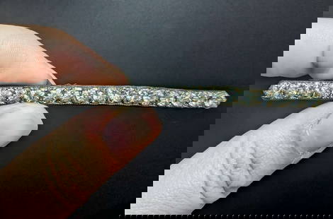 antique estate jewelry: bar pin brooch: probably Edwardian or Victorian antique bar pin with multiple clear cut rhinestones in a silver toned setting (silver plated?)about 3 1/2&quot; long