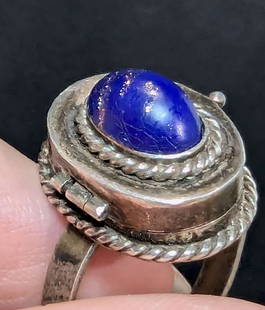 antique estate jewelry: Native American ring: vintage or possibly even antique marked Sterling silver pill or poison ring with hinge and lid to reveal hidden compartment and gold flecked blue Lapis Lazuli cabochon center stone, illegible ma