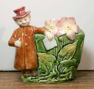 antique figural Majolica small planter pot: beautifully made antique pottery Majolica small jardiniere or vessel with man in a hat and long coat standing next to some flowers&comma; numbered as shown underneathabout 5 1/4&quot; tall overall