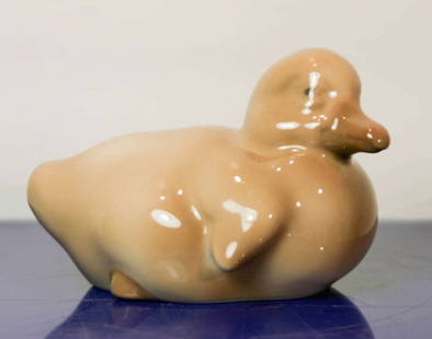 vintage Danish porcelain figural bird: Danish porcelain statue shaped like an adorable brownish colored duckling and marked as shown Made in Denmark B and G (Bing and Grondahl) and numbered 1548 and with artist's mark