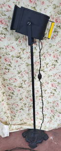 antique projection lamp by Viking Products: cool and unusual lamp with magnifying lens and working lightbulb behind by Viking Products and named Hercules and on an adjustable floor model stand with cast iron designed base and the original Bakel