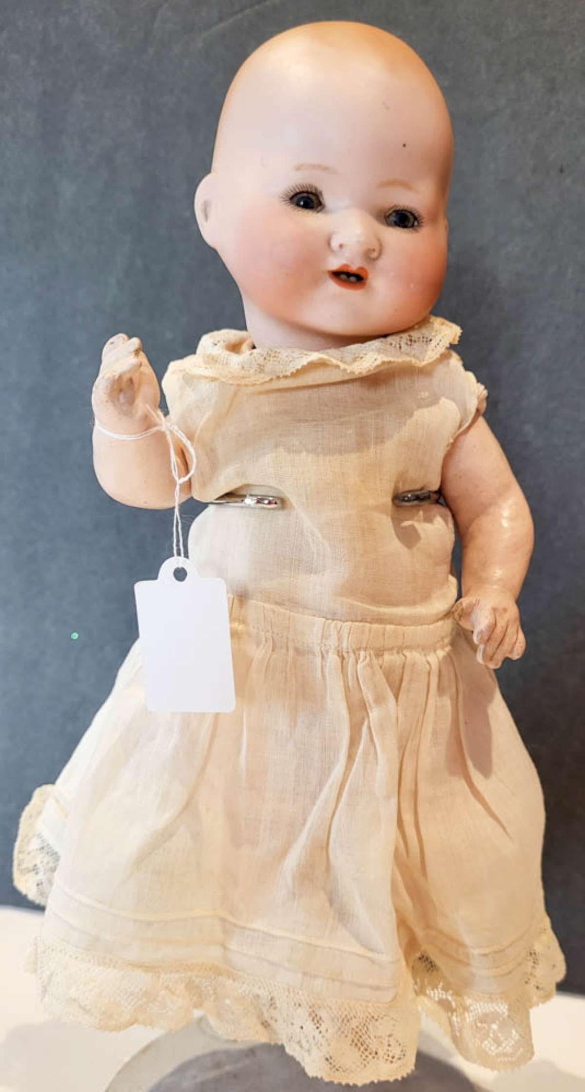 antique Armand Marseille porcelain baby doll: adorable marked A.M. Germany bisque or porcelain head baby doll with open mouth and teeth showing, blue sleepy eyes, hand painted eyelashes and composite posable body