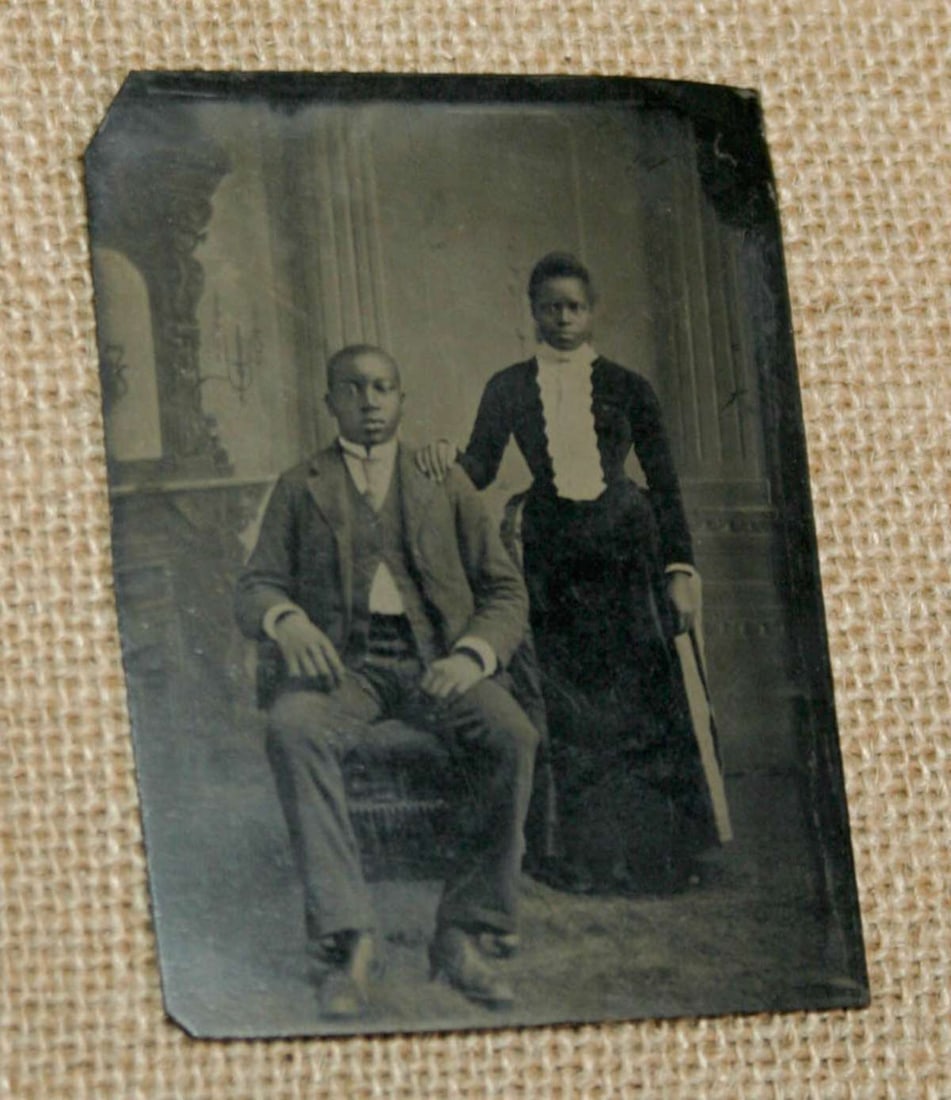 antique tintype photograph Black Americana: ca. 1890's tintype photograph with great crisp tonality and unusual in that it depicts a portrait of an African American couple: the gentleman sitting and the lady standing behind himabout 2 1/2&