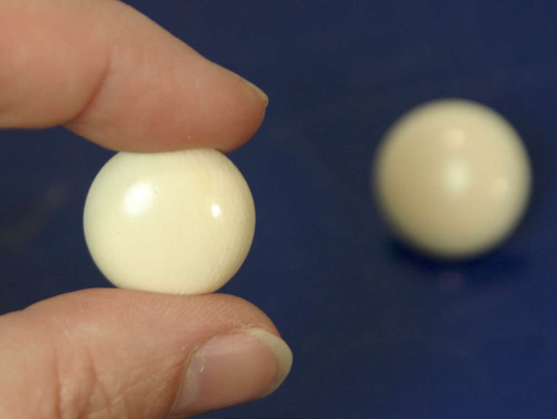 vintage estate jewelry: bone earrings: vintage bone pair of earrings for pierced ears, illegibly marked (possibly gold)