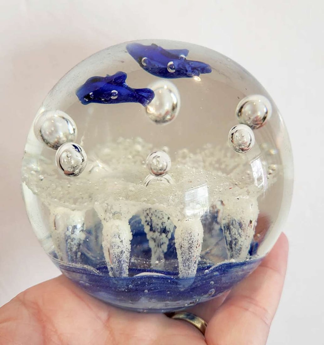 vintage glass paperweight with fish design: vintage round clear paperweight with blue waves and pair of dolphins and bubbles, unmarked