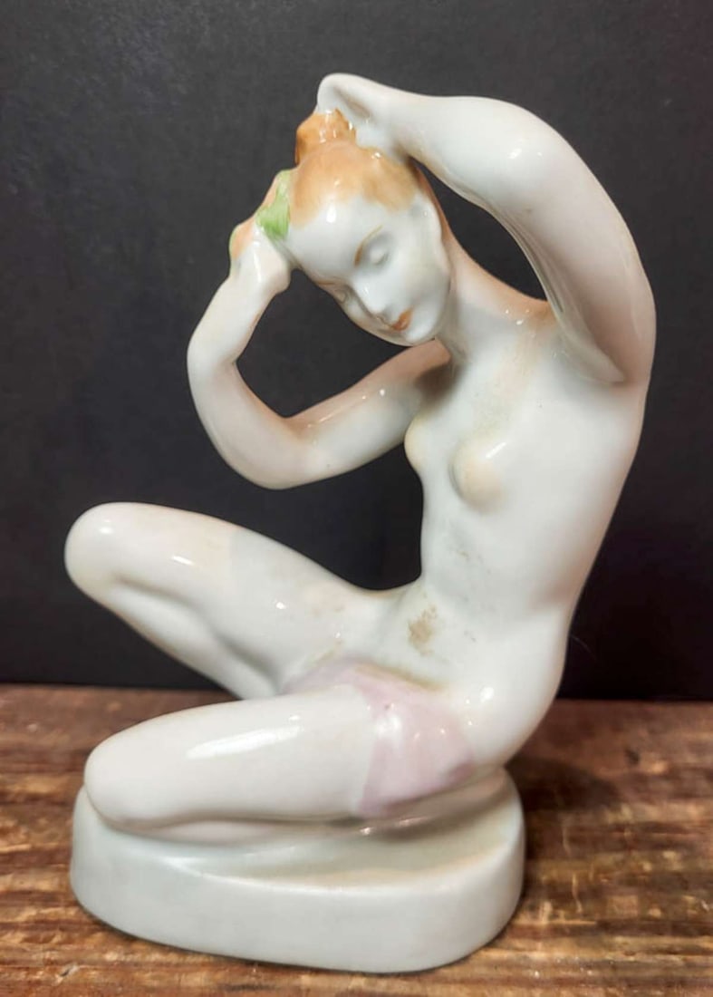 vintage Art Deco figural nude statue: vintage or antique Aquincum Budapest (Hungarian) porcelain sculpture depicting a kneeling nude woman putting flowers in her hair about 6 1/2" tall overall