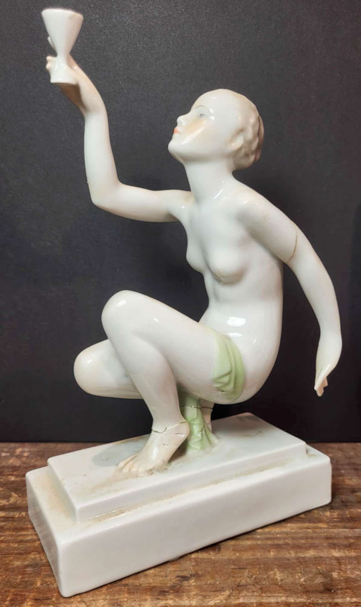 vintage Art Deco figural nude statue by Herend: vintage or antique marked Herend porcelain sculpture depicting a kneeling woman holding up a cup or chalice, designed by Jozsef Gondos for Herend about 9 1/4" tall overall