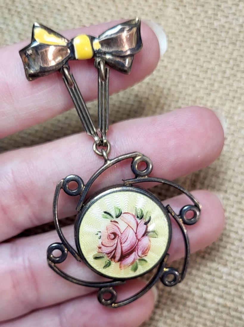 antique estate jewelry: gold filled guilloche pin: likely French silver, enameled and guilloche pin brooch with ribbon bow top and dangly sunburst bottom part with hand painted floral or flower design and back with bubble and markings as shown o