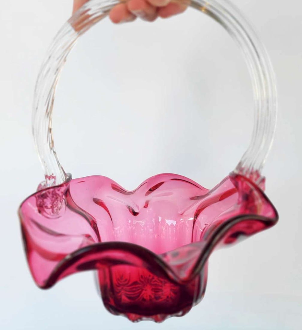 antique cranberry glassware bowl: beautiful Cranberry glass bowl or dish with a clear ribbon handle with floral ends and scalloped edge and swirl design body