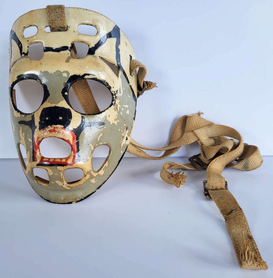 vintage hockey goalie mask: ca. 1970's street or ice hockey mask made from fiberglass and with hand painted design and fabric straps, would make a cool Halloween mask!