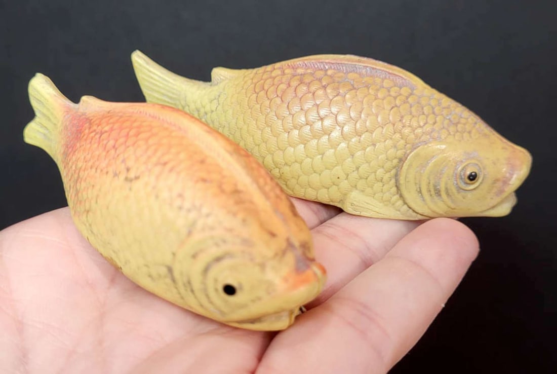 PAIR antique animal shaped celluloid toys: set or lot of two vintage or antique celluloid fish shaped toys, both bottoms have separated a bit so not sure if these were meant to be baby rattle or not, one marked USA and illegible ma