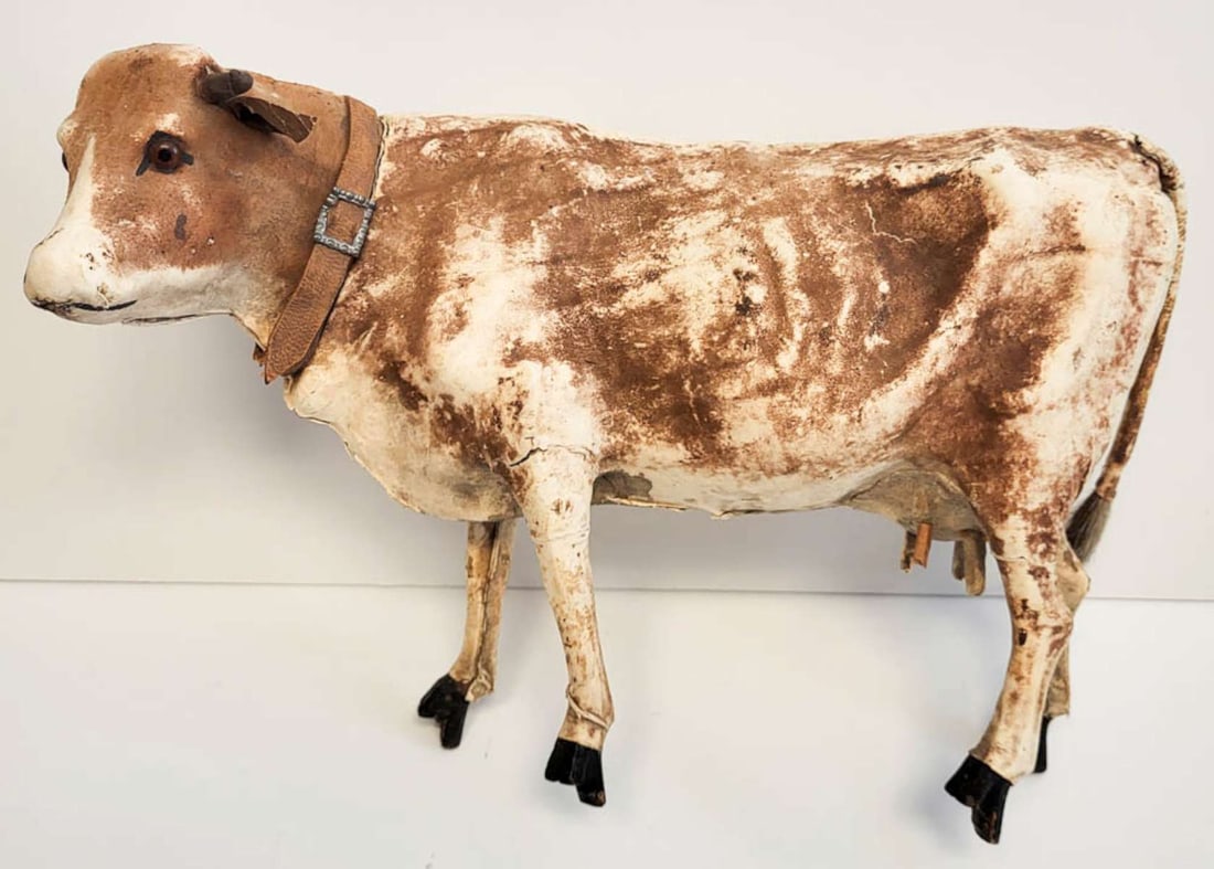 antique Folk Art pull toy cow: antique Primitive pull toy (missing wheeled platform) shaped like a brown and white cow, seam split by the neck so I don't want to force the head to check if the sound mechanism still works