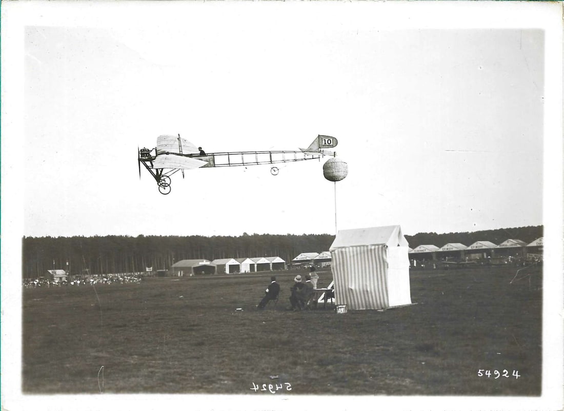 1910 aviation photograph of a Tellier monoplane: This is an original 1910 photograph of a Tellier monoplane flying low past a distance marking balloon. The image by professional photographer Branger is so sharp and clear that you can actually see th