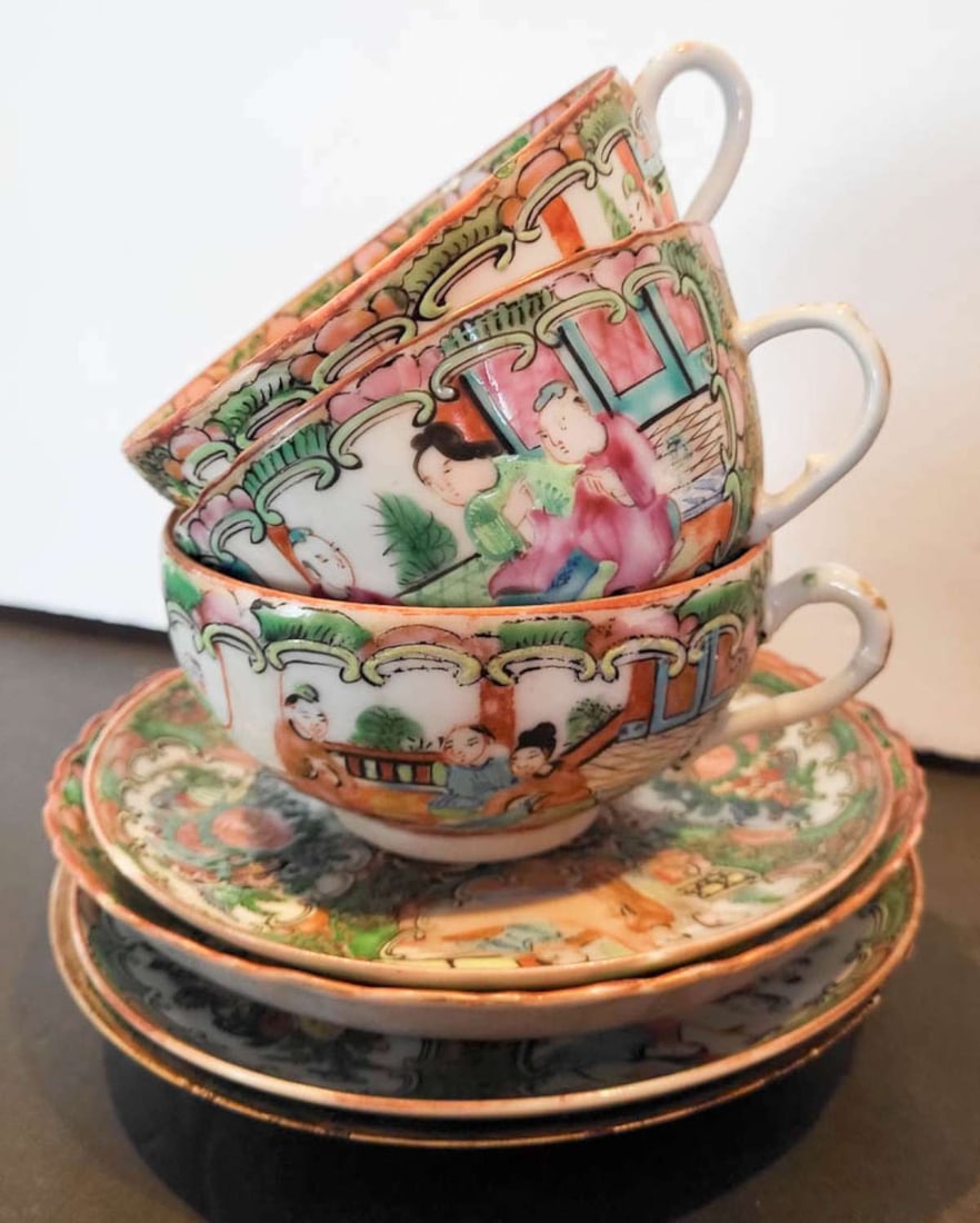 antique Chinese Famille Rose partial tea set: partial antique Chinese tea set in the Famille Rose style, consisting of a set of 4 mismatched saucers (1 smaller, 1 deeper bowl and 2 matching) and 3 matching handled cups, all unma