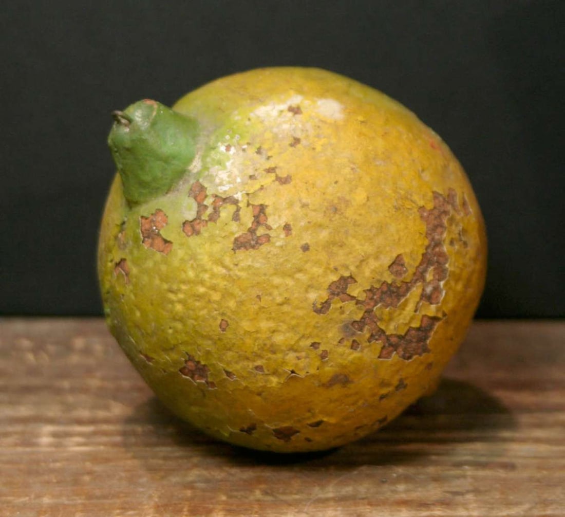 antique pottery coin bank: antique clay or pottery fruit shaped coin bank, depicting a yellow and green lemon or lime (shaped more like an orange?), no maker's mark