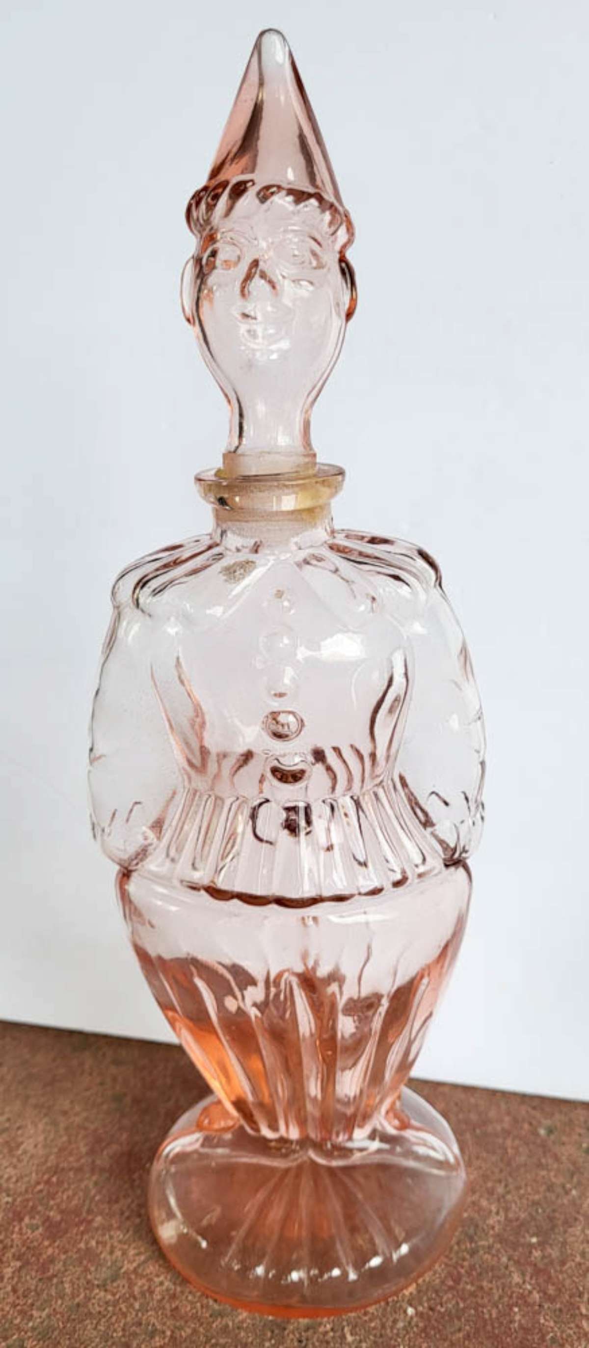 vintage MCM pink glass harlequin bottle: vintage Mid Century Modern pink glass bottle with an Elf or Clown shape and the stopper is the head, marked Made in France but I've seen these bottles online and they were listed as being f