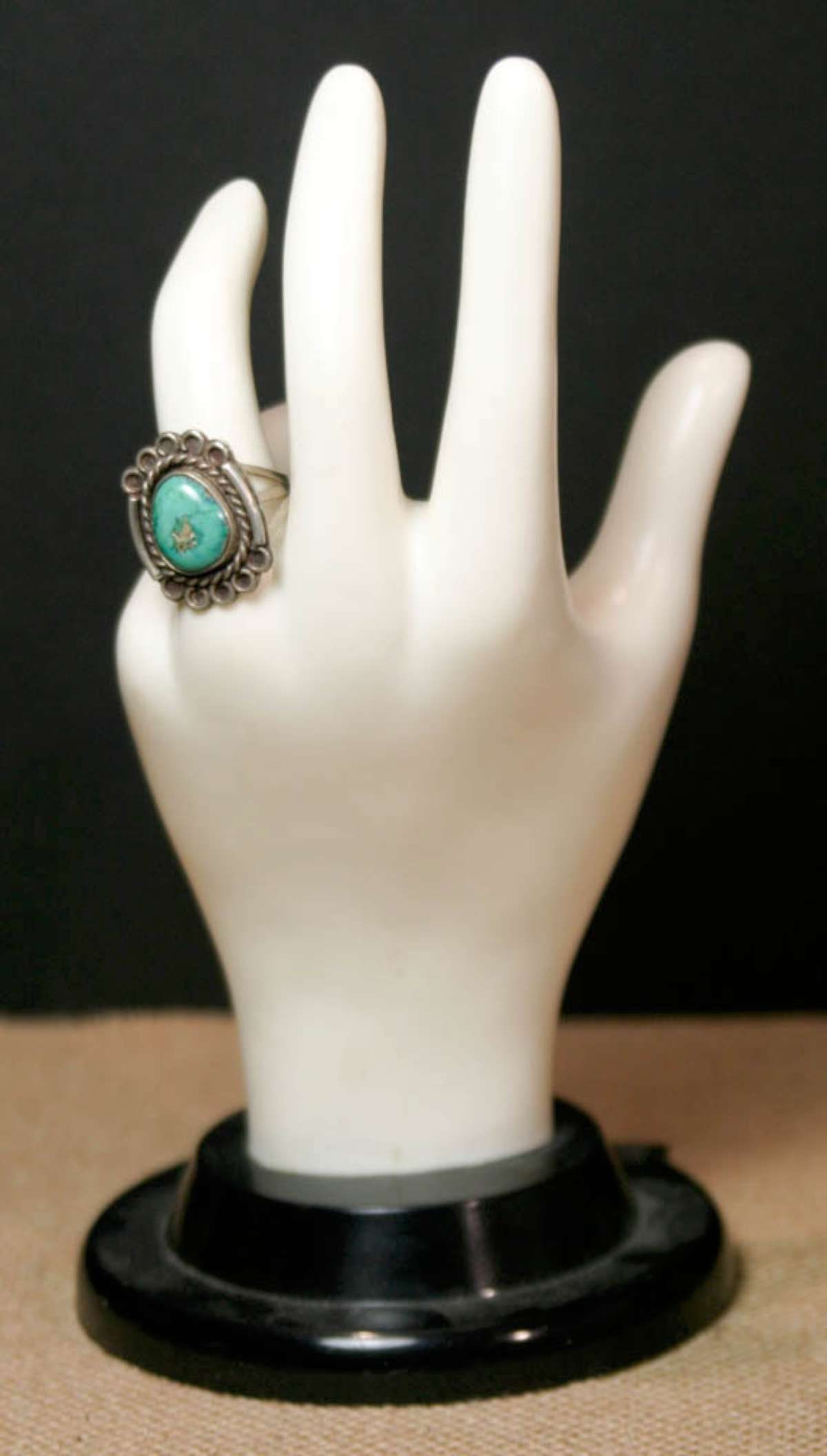 vintage estate jewelry: Turquoise ring: unmarked and untested so not sure if it's silver, tri-banded ring with Turquoise center stoneabout a ring size 7 1/2