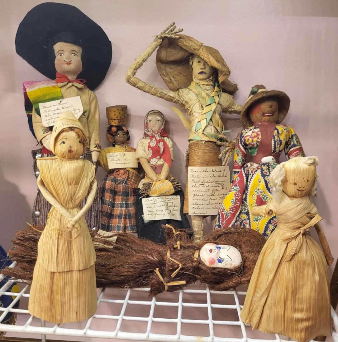 vintage ethnic South American dolls: lot or set of 8 small to medium sized "tourist" dolls, from corn husk dolls, to a Guatemalan man and woman and what appears to me Mexican dolls, most with hand written tag