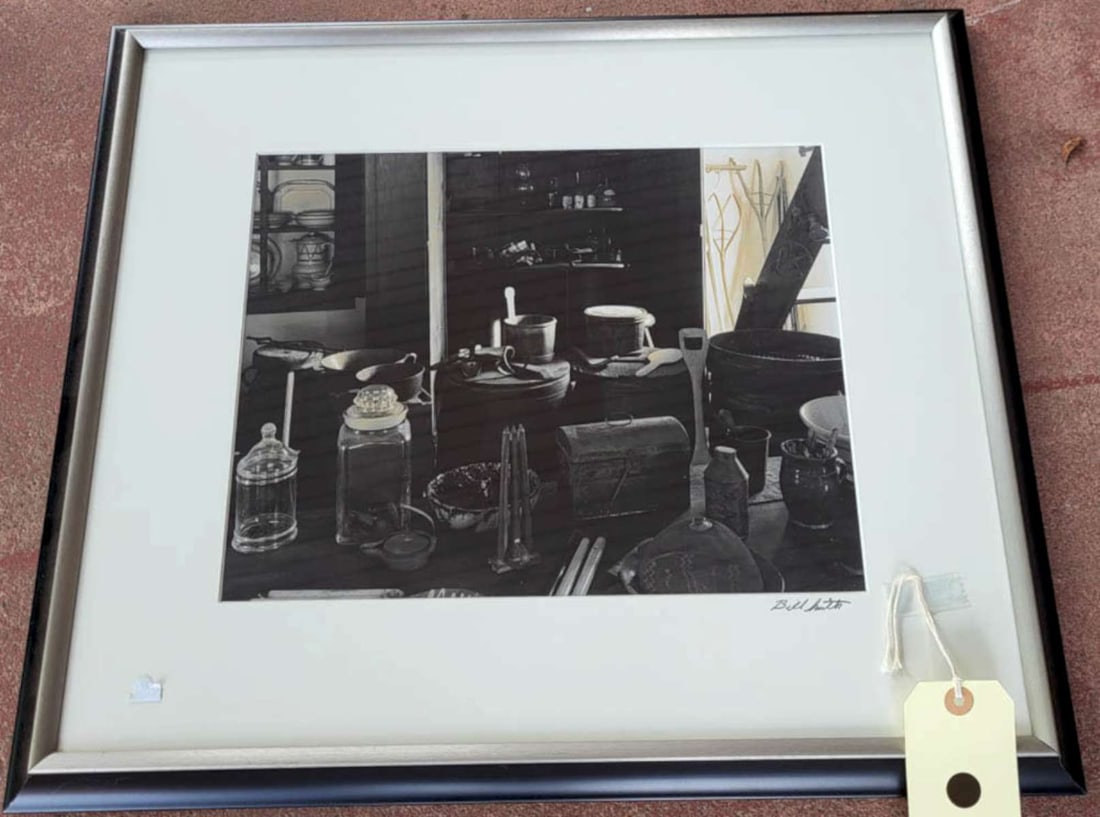 original Bill Smith b/w photograph: nicely framed and matted original black and white photograph signed Bill Smith lower right and depicting a house or antique store with a table set with antique apothecary jars, candle moulds&com