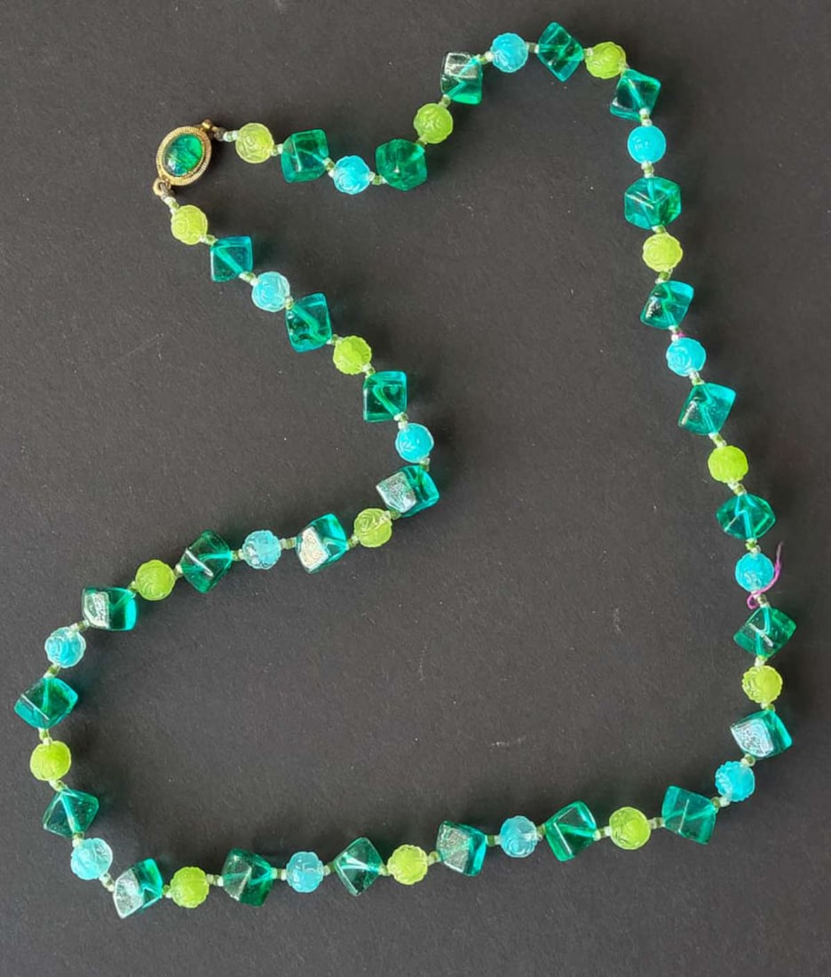 vintage estate jewelry: Japanese necklace: vintage Made in Japan marked plastic carved beads in tones of green and blue and with cabochon style closure