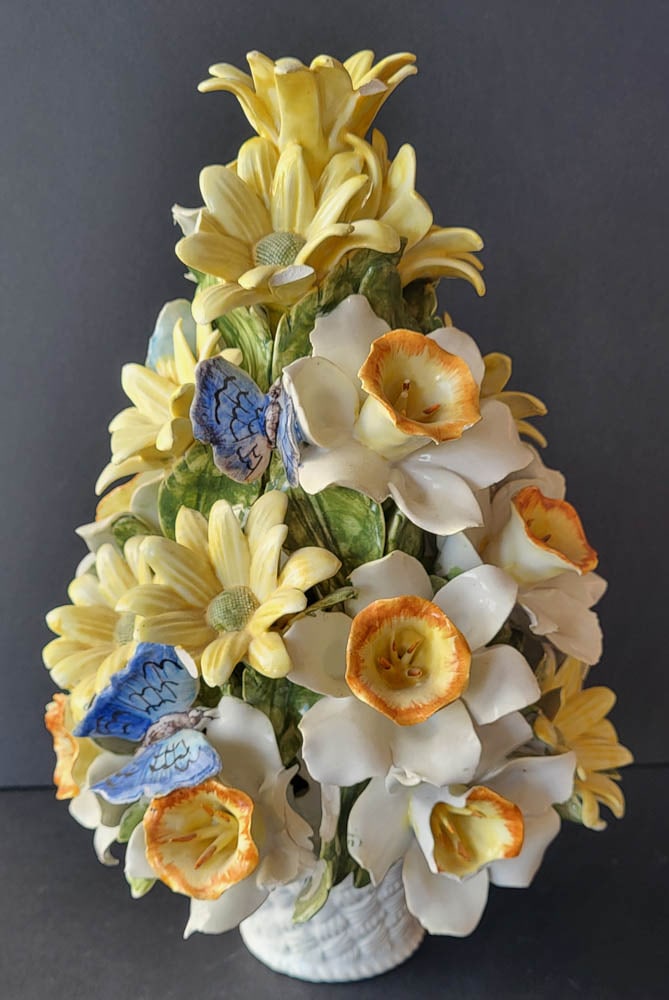 vintage Italian porcelain floral sculpture: impressively large vintage porcelain flower statue in a white planter pot and with white with orange-yellow hearts Daffodils, other yellow flowers and blue and purple butterflies, marked u