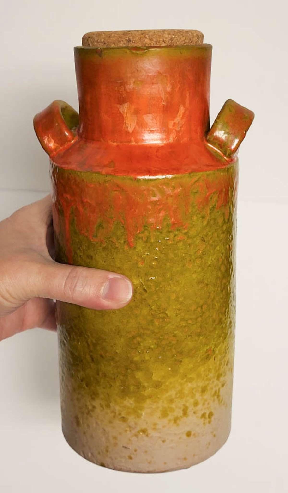 vintage Italian pottery vase: vintage ca. 1950's or 60's unmarked but either German or Italian birch bark textured fat lava style double handled pot or jug with cork stopper and with orange, cream and green glaze