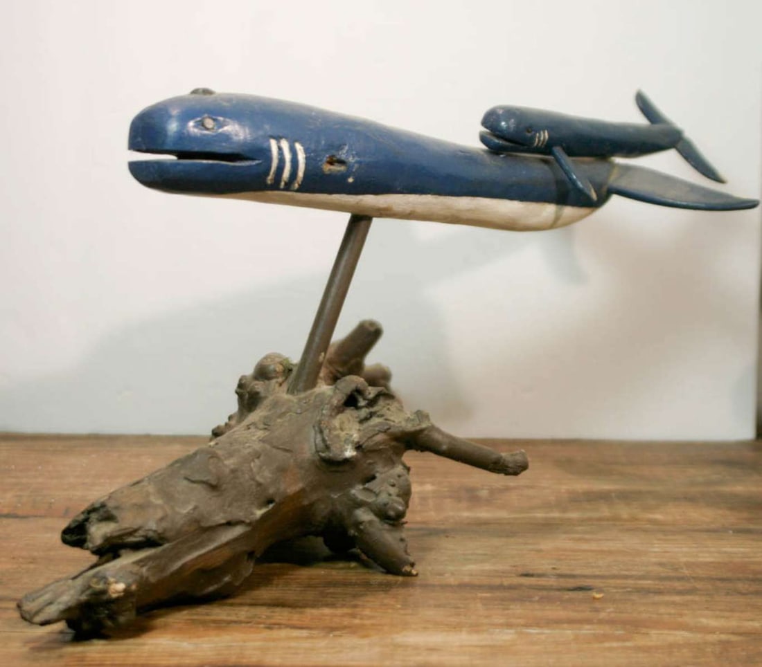 large vintage carved whale carving on stand: vintage or antique Folk Art carved mother (cow) and baby (calf) blue whale wooden statue on a knotty burl tree branch, hand painted blue and white, not signed by the artist