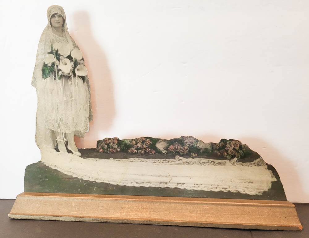 vintage wedding standee sign photograph: unusual ad or advertisement standee sign for or by J. Bodziak Photo Statuettes Mfg in Philadelphia Pennsylvania, depicting a a beautiful bride with veil, floral wedding bouquet and flowers