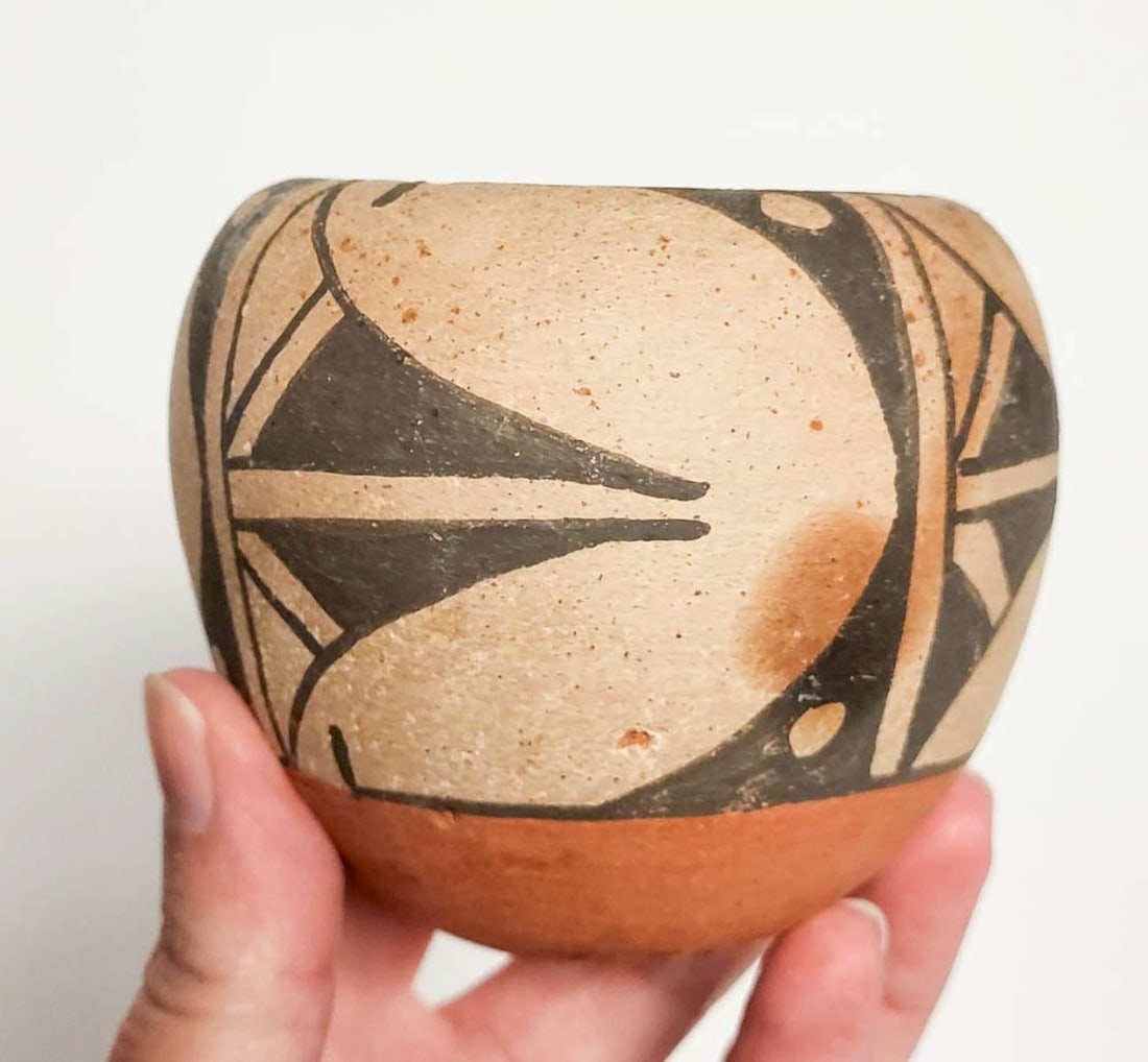 vintage Pueblo pottery vessel: vintage or antique Southwest Native American Indian clay pot or jar with brown, black and cream hand painted geometric design, not sure which tribe this is made by (illegible mark on