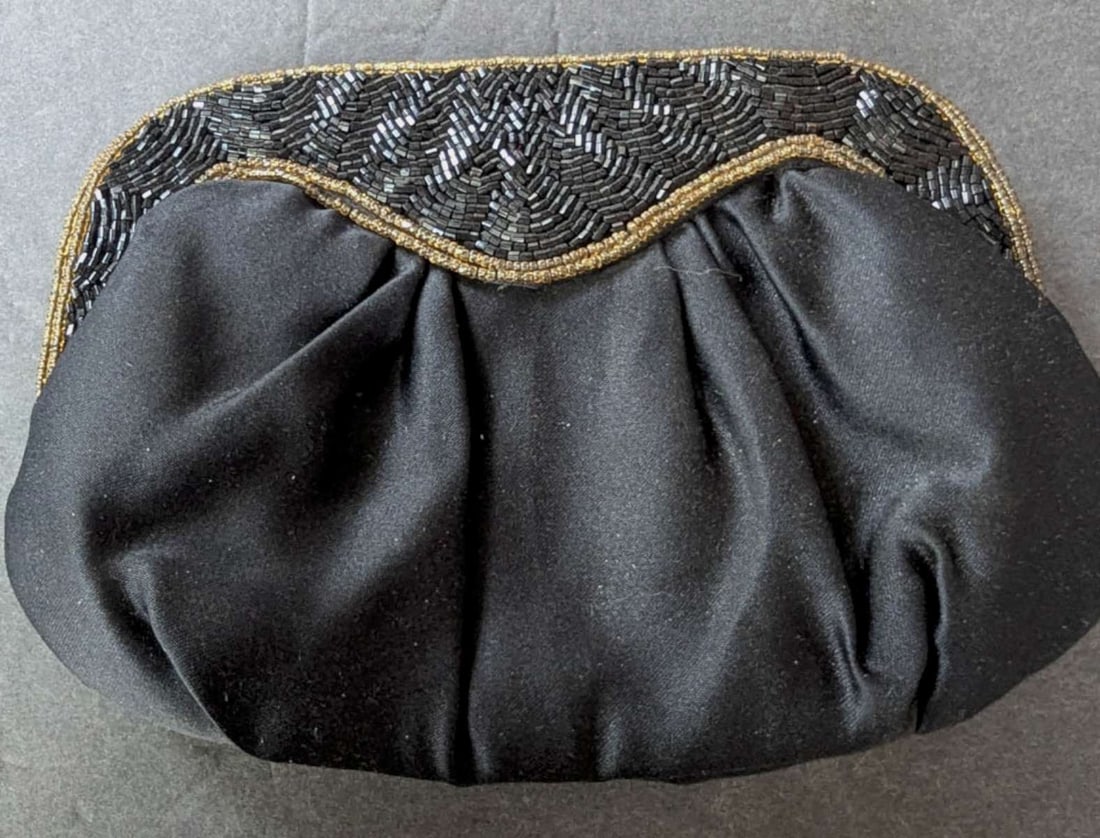 vintage retro ladies clutch purse: vintage ladies' handbag or clutch with black fabric and micro-beaded and gold colored thread edge and snap closure, maker's label