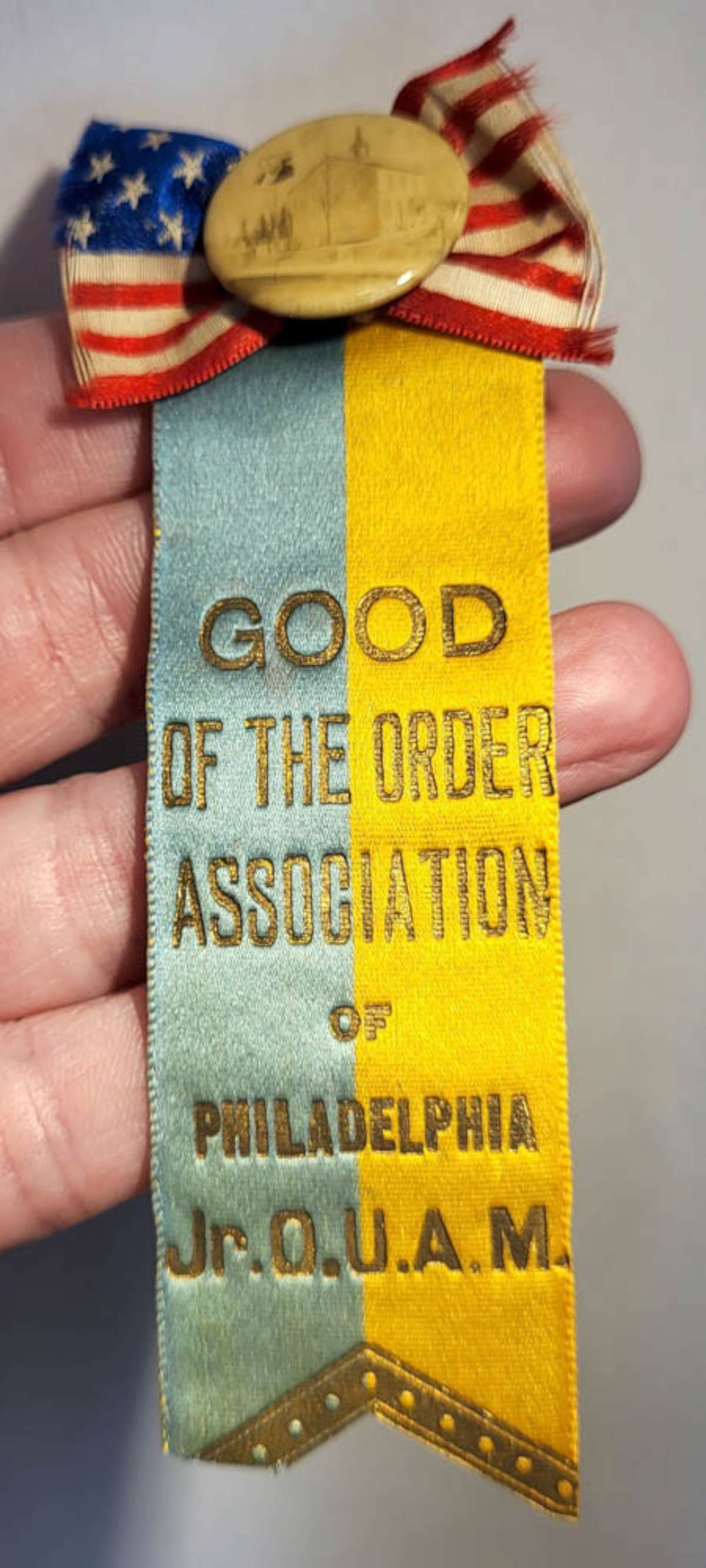 antique ribbon Philadelphia Masonic button: antique photo button or pin depicting a church and what looks to be President Washington, pinned to an patriotic American flag ribbon and with a long yellow and blue ribbon with gilt lettering r
