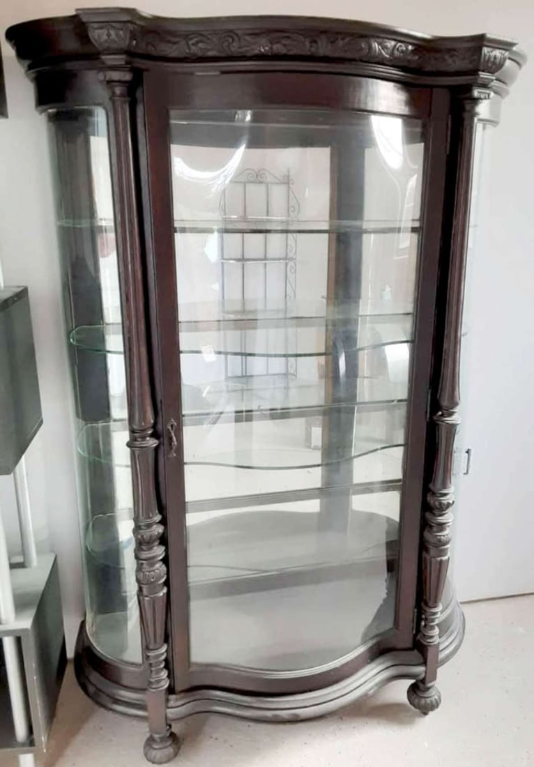 antique mahogany bowfront display cabinet: large antique display case or cabinet with 2 bowed glass side panels and a replacement plexi-glass bowed front panel in the door. carvings throughout and on carved feet, comes with several curve