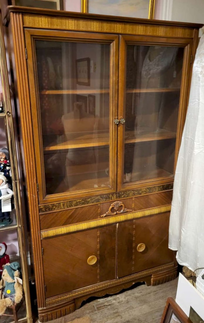 antique Art Deco period hutch or display cabinet: antique Art Deco period display cupboard with beautiful geometric veneer with burl design, applied scroll and the original metal and Bakelite pulls, glass double doors on top with two
