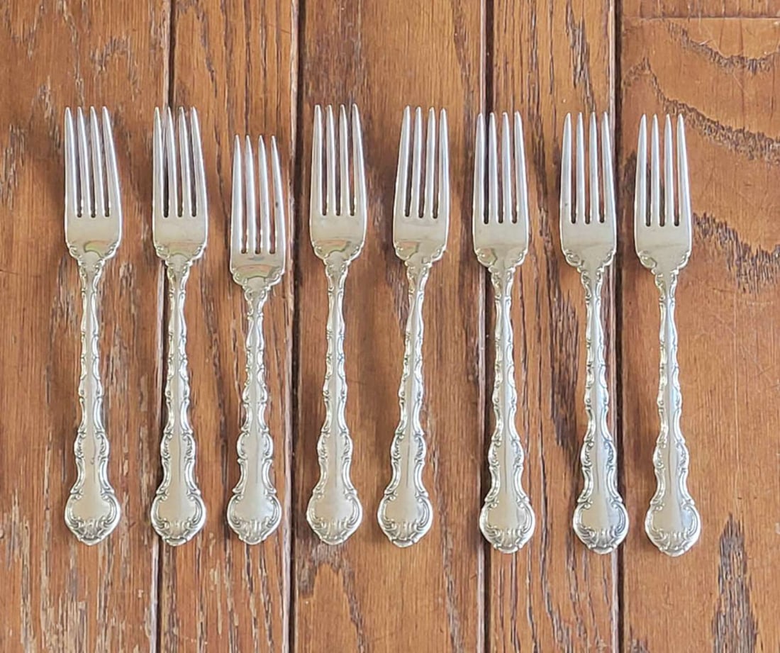 Sterling silver Gorham flatware - forks: antique set of 8 marked Sterling Gorham dinner forks with elaborate handles, NOTE: one fork is slightly shorter than the otherstotal weight 426 gramsInfo from online search: "Flowing scroll
