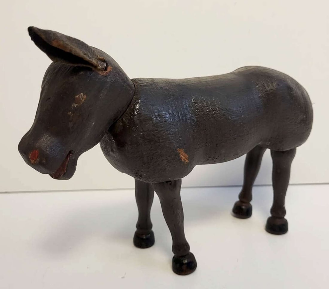 antique carved wooden Schoenhut donkey: antique carved wooden toy Donkey with black paint and hand painted eyes, by Schoenhut, with adjustable legs