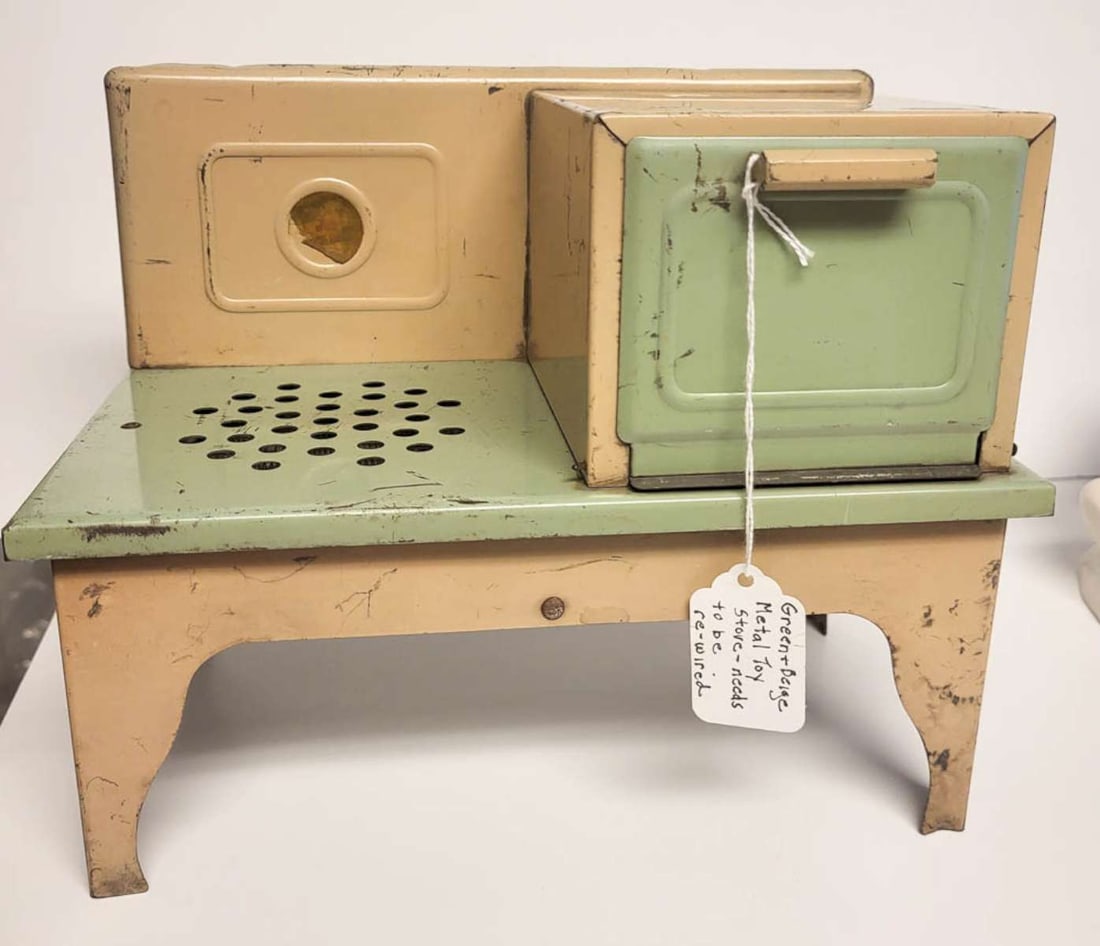 antique tin stove toy by Kingston: Made in USA by by Kingston as shown marked underneath, beige and sage green electric toy stove with pull down oven door