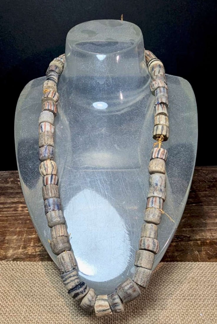 antique estate jewelry: ethnic necklace: long (and heavy!) African trade bead necklace with multi colored striped sand cast beads, hand tied with twineaprox. 26" in length