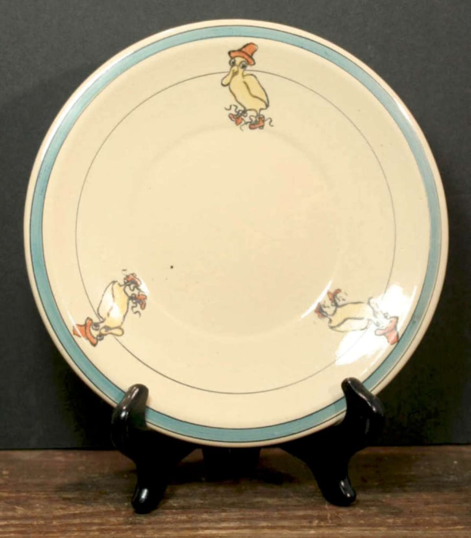 antique Roseville pottery plate: antique marked RV on the bottom as shown baby or kids' plate with three yellow ducks wearing a hat and matching orange shoes design8" in diameter