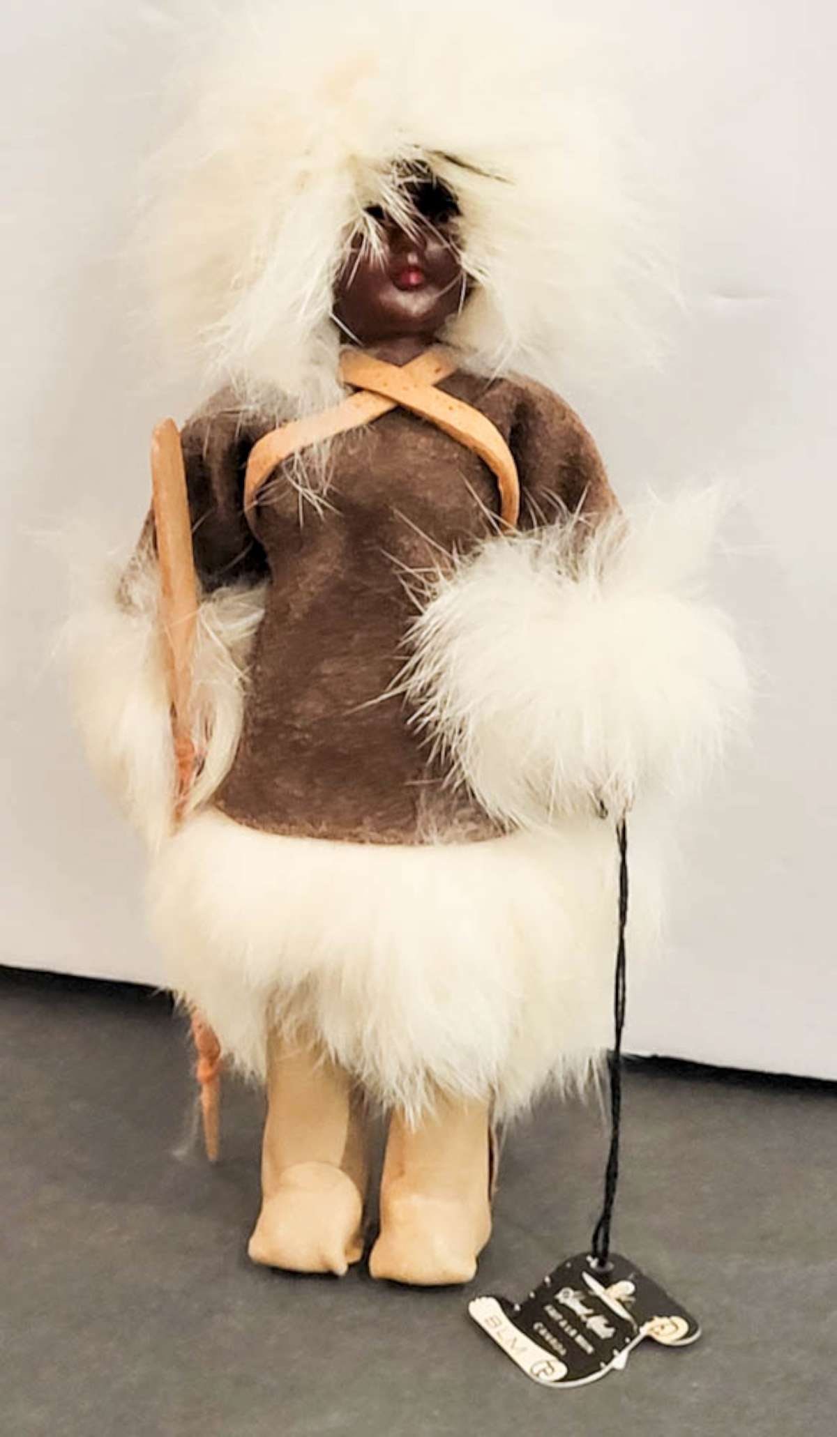 vintage Native or ethnic doll with fur: paper label for BLM Hand Made Canada, dark skinned plastic sleepy eyes doll with white real fur, ca. 1970'sabout 7 3/4" tall