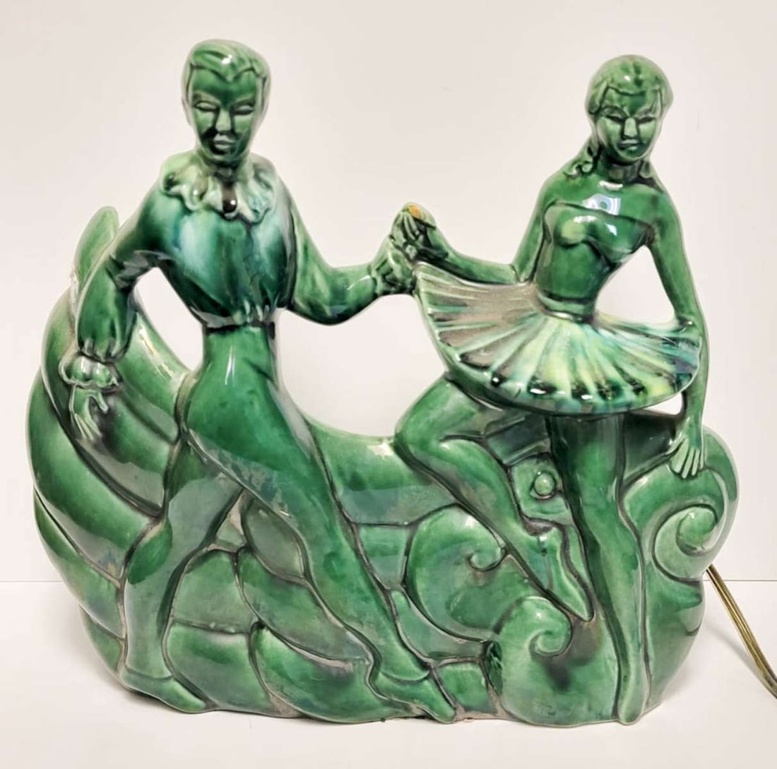 vintage MCM porcelain figural TV lamp: vintage Mid Century Modern glossy green glazed pottery or porcelain table lamp depicting a man and a woman in fancy clothing dancing together, recently rewired