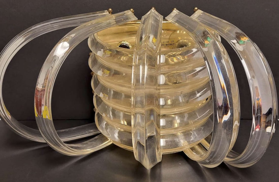 MCM Lucite wall light fixture: vintage late Mid Century Modern or Hollywood Regency style clear Lucite banded wall mounted brass base metal sconce or lamp with posable semi circular rings