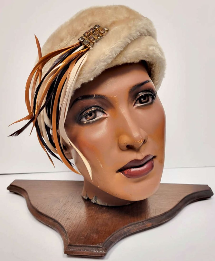 vintage or antique ladies hat with brooch: late Art Deco period ladies' hat with beige top material with cream, orange brown and black feather detail and brooch design with cut rhinestones and interior felted wood lining,