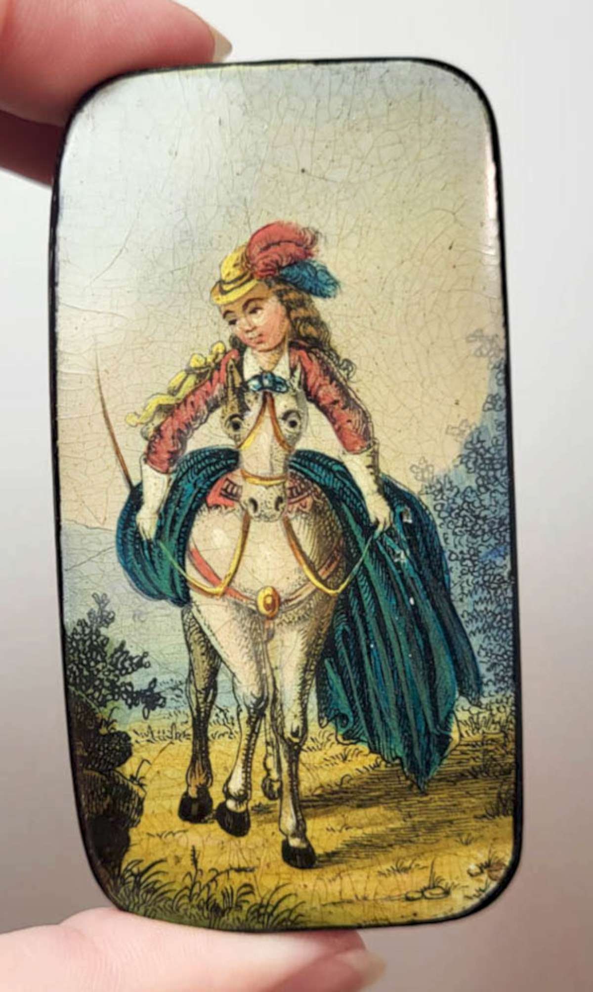 antique wooden erotica box: antique 1800's (possibly earlier) lacquered wooden trinket or pill box with black background and hand painted lid with a design of a lady on a white horse and the perspective makes the scene naug