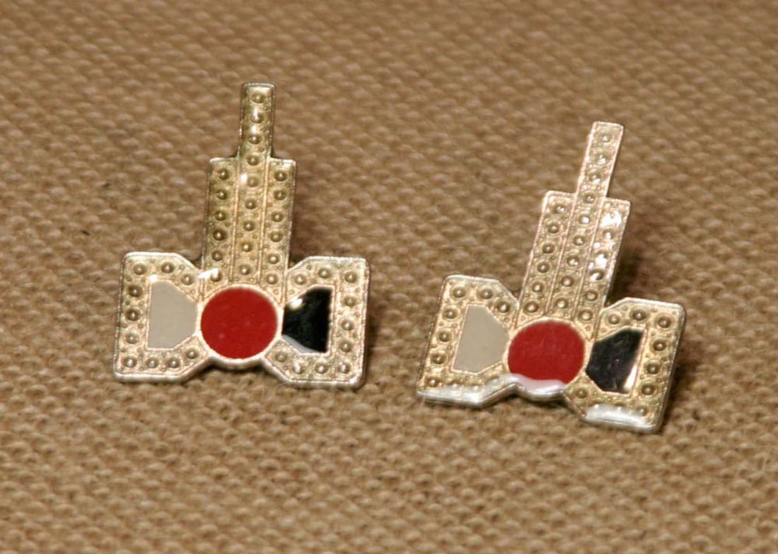 antique estate jewelry: enameled earrings: vintage or antique late Art Deco or early MCM or Mid Century Modern Era pair of pierced earrings with an enameled vibrant red, white and black stepped and geometric design or abstract ribbon and