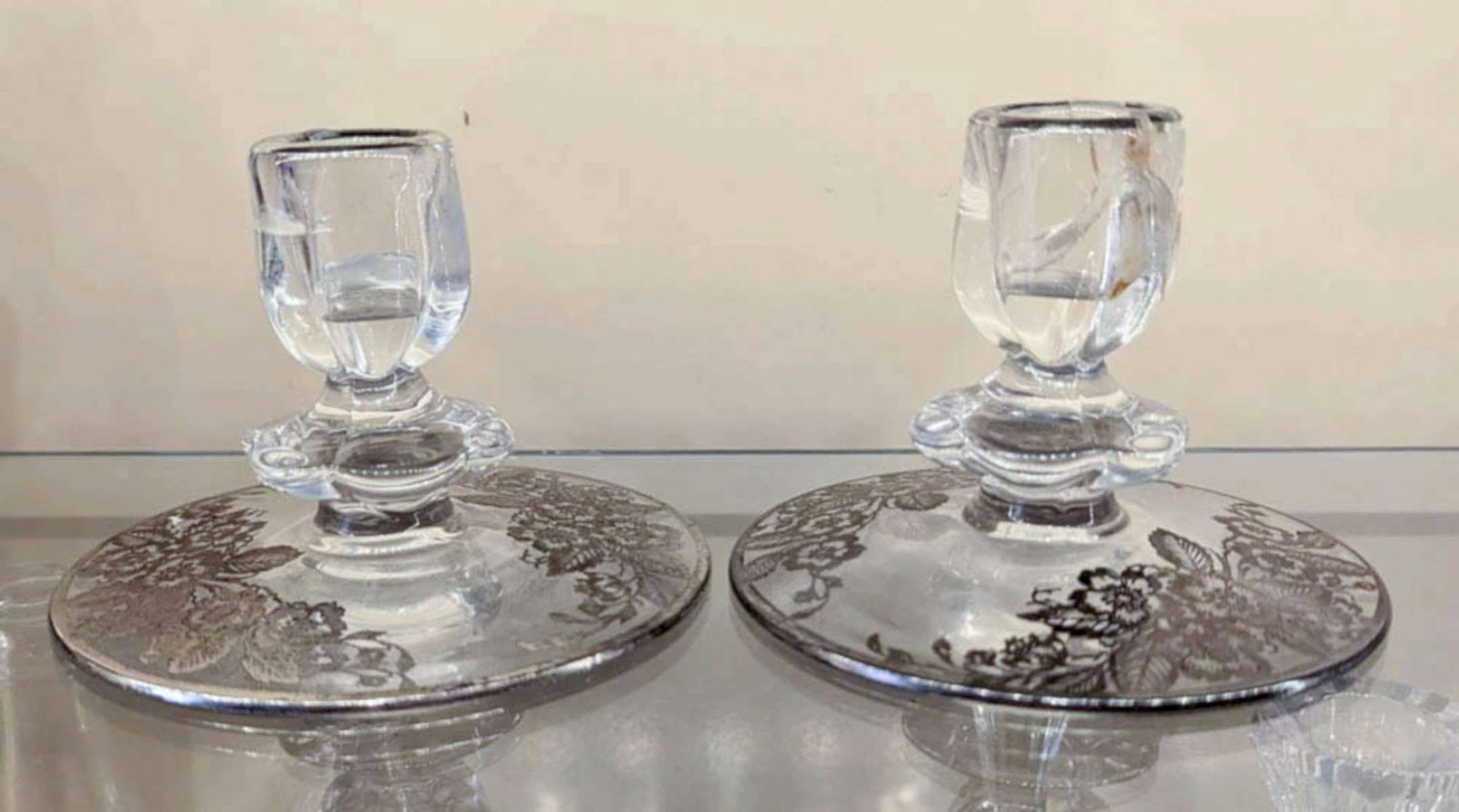 antique silver overlay glassware: pair of clear glass candlesticks or candle holders with ornate floral or flower overlay in silver