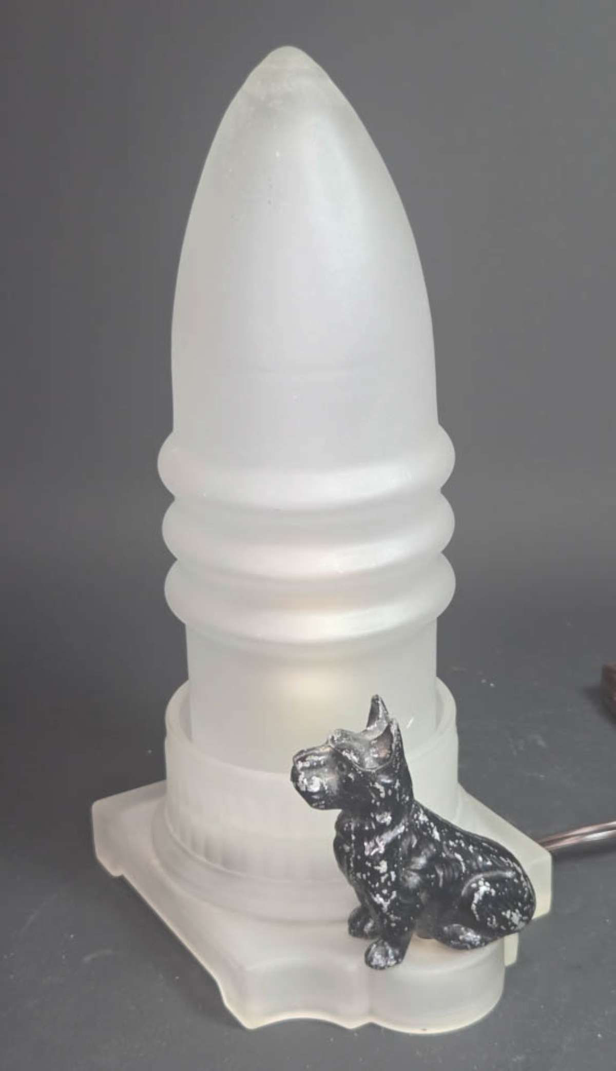 antique Art Deco period table lamp with dog: vintage or antique Art Deco frosted glass 2-part bullet boudoir lamp or nightlight with black Spelter or white pot metal Scottish Terrier or Scottie figurine or figural dog statue on top