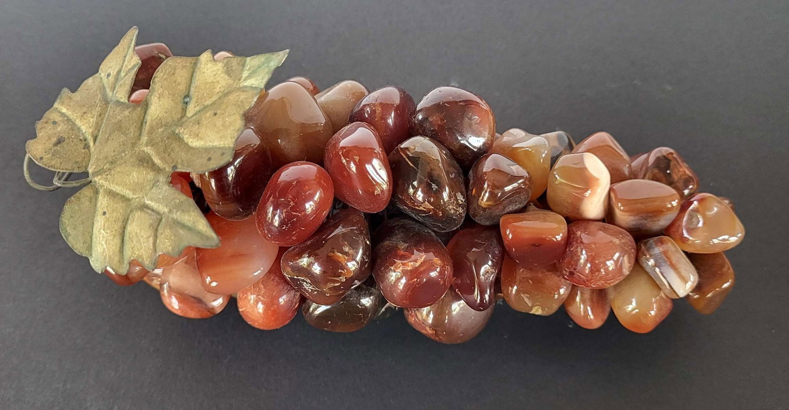 vintage Chinese stone grape cluster: vintage or antique Agate or Jasper hardstone red, brown, orange toned cluster of grapes, with brass leaves