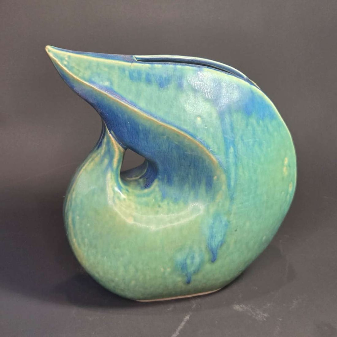 vintage MCM Asian swoop vase: retro Mid Century Modern style (or possibly actually from the Era) pottery vase with swoop design, beautiful blue and green drip glaze and illegible Asian character artist's mark on the bot