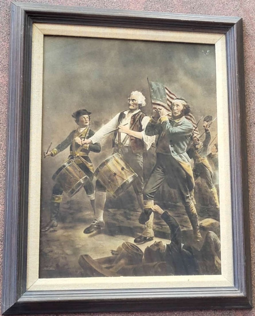 antique Yankee Doodle print in frame: antique copyright 1911 print of a painting originally by Archibald M. Willard (1836 - 1918) in 1876 titled The Spirit of '76 depicting a few soldiers playing drums and a flute with an American fl