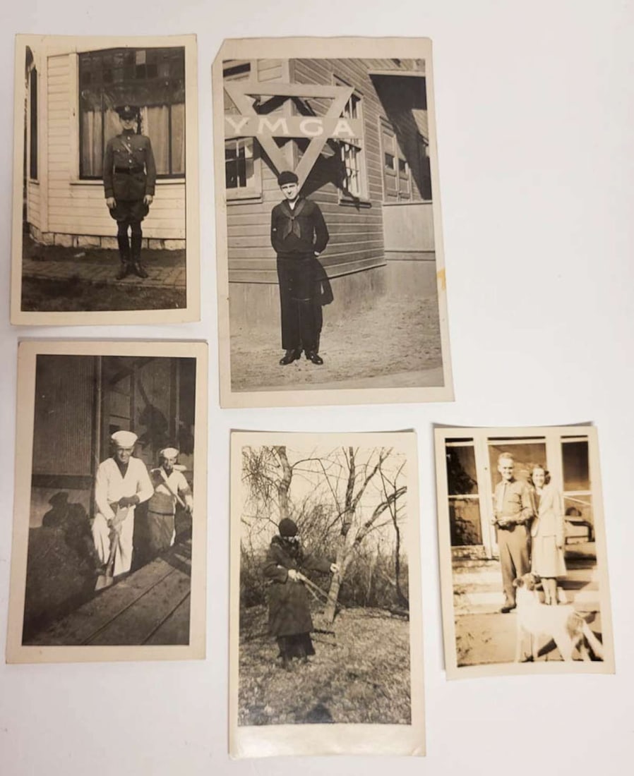 vintage portrait photographs featuring military: set or lot of five vintage black and white and sepia toned photographs depicting enlisted military men, a woman with a rifle or other weapon and a man standing in front of a YMCA posing for the 